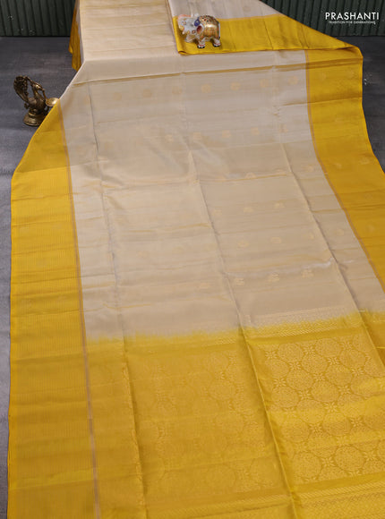 Pure soft silk saree beige and yellow with zari woven buttas and zari woven butta border