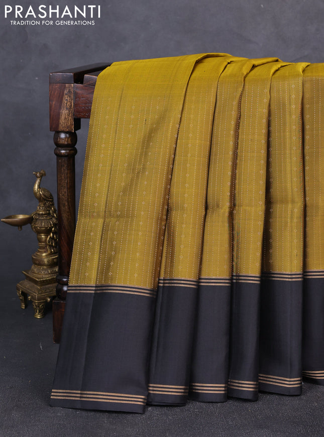 Pure soft silk saree mustard green and black with allover zari weaves  and rettapet zari woven border
