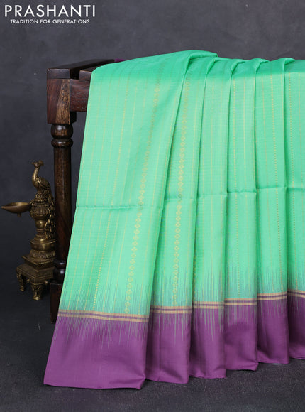 Pure soft silk saree teal green and purple with allover zari weaves  and zari woven simple border