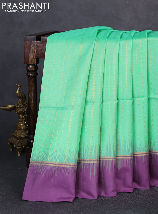 Pure soft silk saree teal green and purple with allover zari weaves  and zari woven simple border
