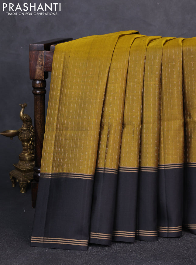 Pure soft silk saree mustard green and black with allover zari weaves  and rettapet zari woven border