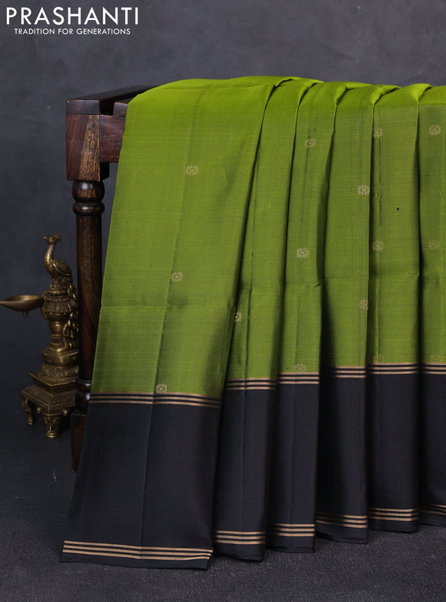 Pure soft silk saree light green and black with zari woven buttas and rettapet zari woven border