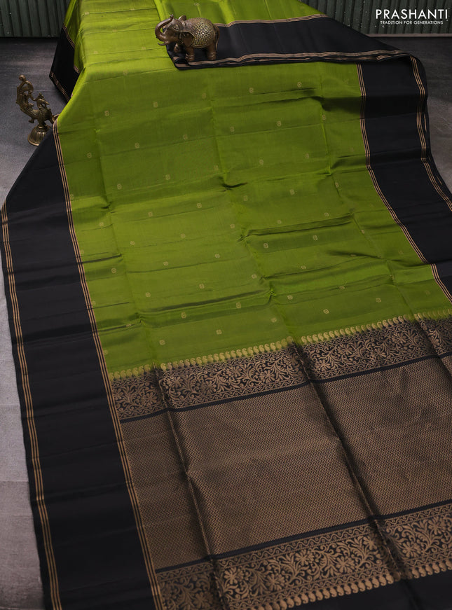 Pure soft silk saree light green and black with zari woven buttas and rettapet zari woven border