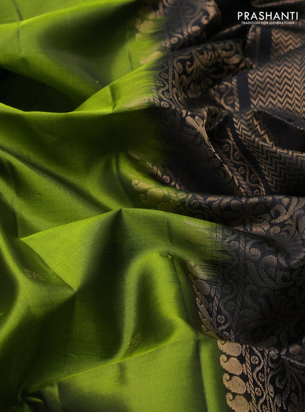 Pure soft silk saree light green and black with zari woven buttas and rettapet zari woven border