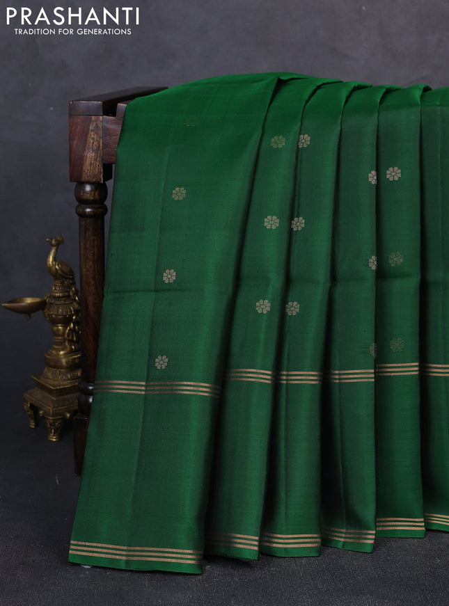 Pure soft silk saree green with allover zari woven buttas and long rettapet zari woven border
