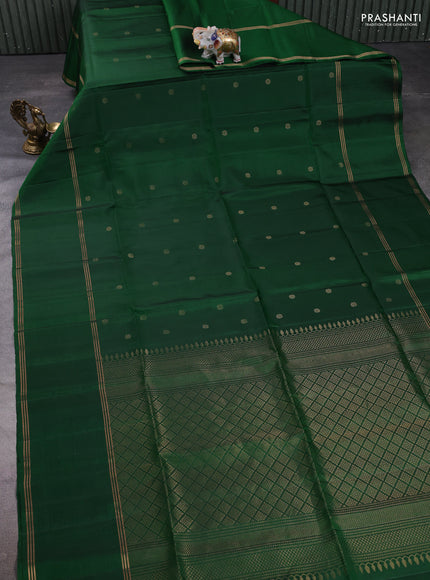 Pure soft silk saree green with allover zari woven buttas and long rettapet zari woven border