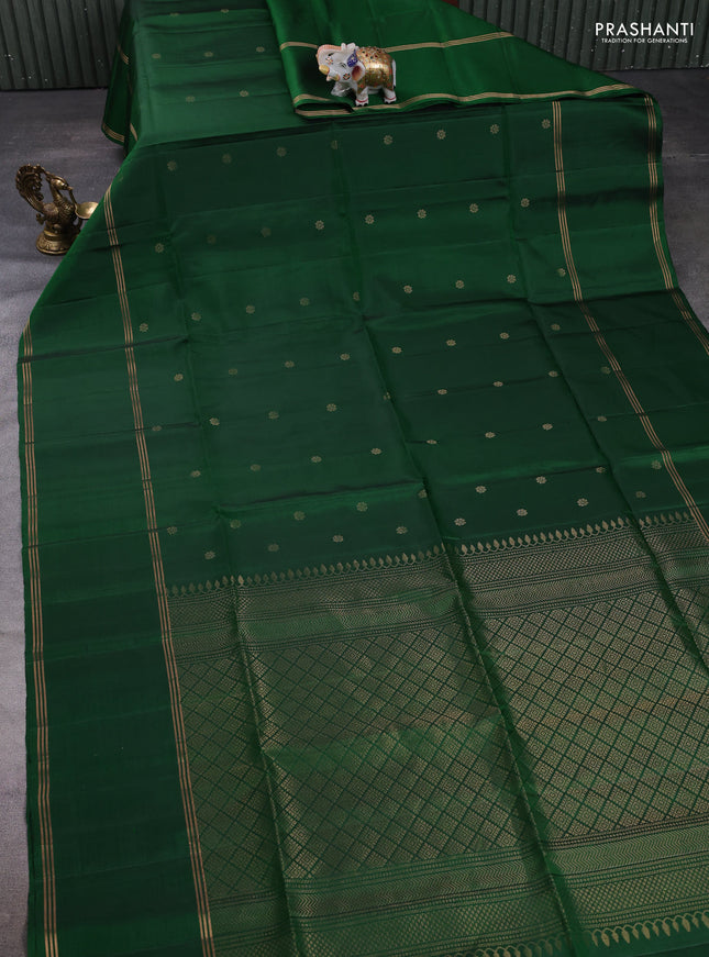 Pure soft silk saree green with allover zari woven buttas and long rettapet zari woven border
