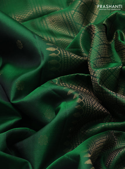 Pure soft silk saree green with allover zari woven buttas and long rettapet zari woven border