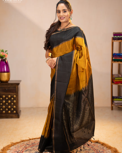 Pure soft silk saree dark mustard and black with zari woven buttas and rettapet zari woven border