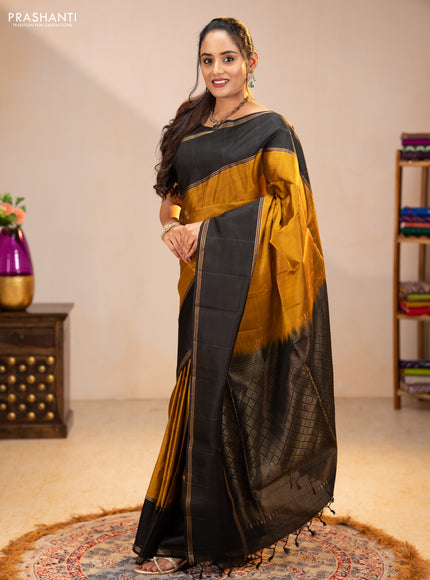 Pure soft silk saree dark mustard and black with zari woven buttas and rettapet zari woven border