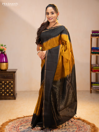 Pure soft silk saree dark mustard and black with zari woven buttas and rettapet zari woven border