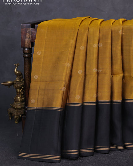 Pure soft silk saree dark mustard and black with zari woven buttas and rettapet zari woven border
