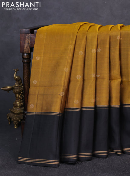 Pure soft silk saree dark mustard and black with zari woven buttas and rettapet zari woven border