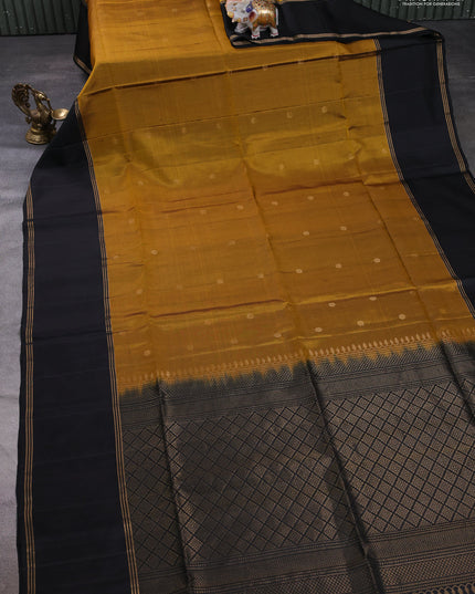 Pure soft silk saree dark mustard and black with zari woven buttas and rettapet zari woven border