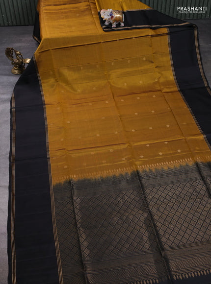 Pure soft silk saree dark mustard and black with zari woven buttas and rettapet zari woven border