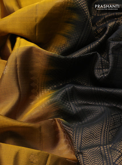Pure soft silk saree dark mustard and black with zari woven buttas and rettapet zari woven border
