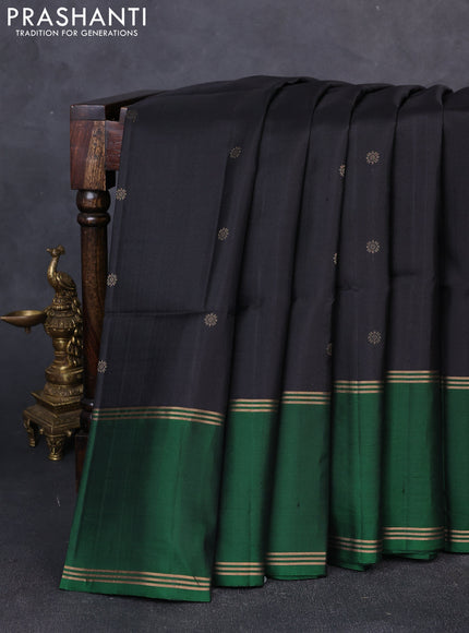 Pure soft silk saree black and green with allover zari woven buttas and long rettapet zari woven border