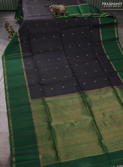 Pure soft silk saree black and green with allover zari woven buttas and long rettapet zari woven border
