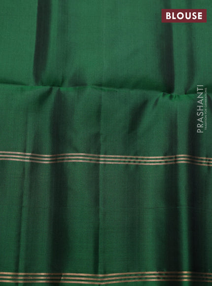 Pure soft silk saree black and green with allover zari woven buttas and long rettapet zari woven border