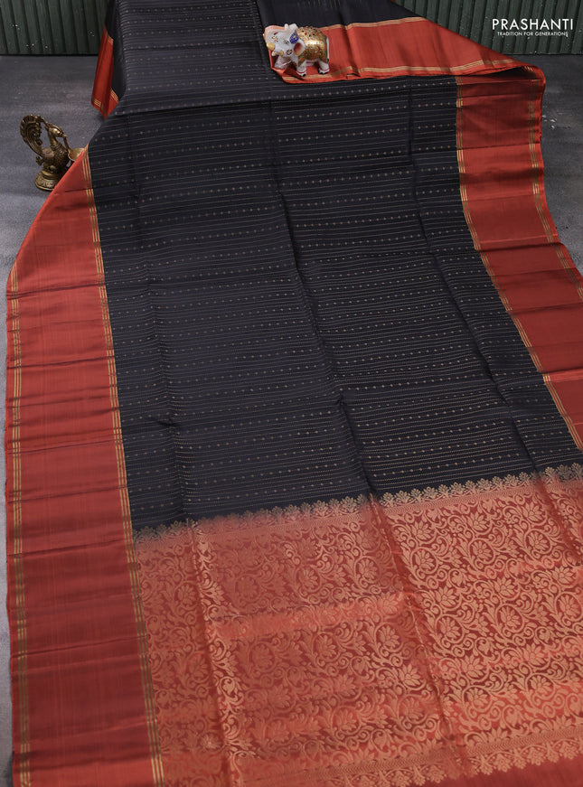 Pure soft silk saree black and orange with allover zari weaves  and long rettapet zari woven border