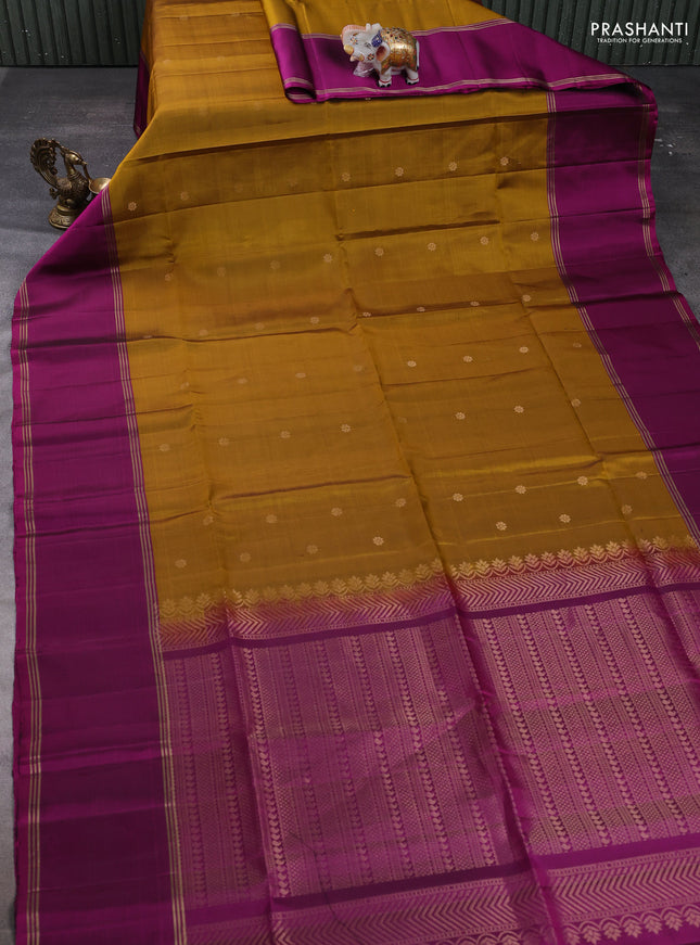 Pure soft silk saree dark mustard and magenta pink with allover zari woven buttas and long rettapet zari woven border