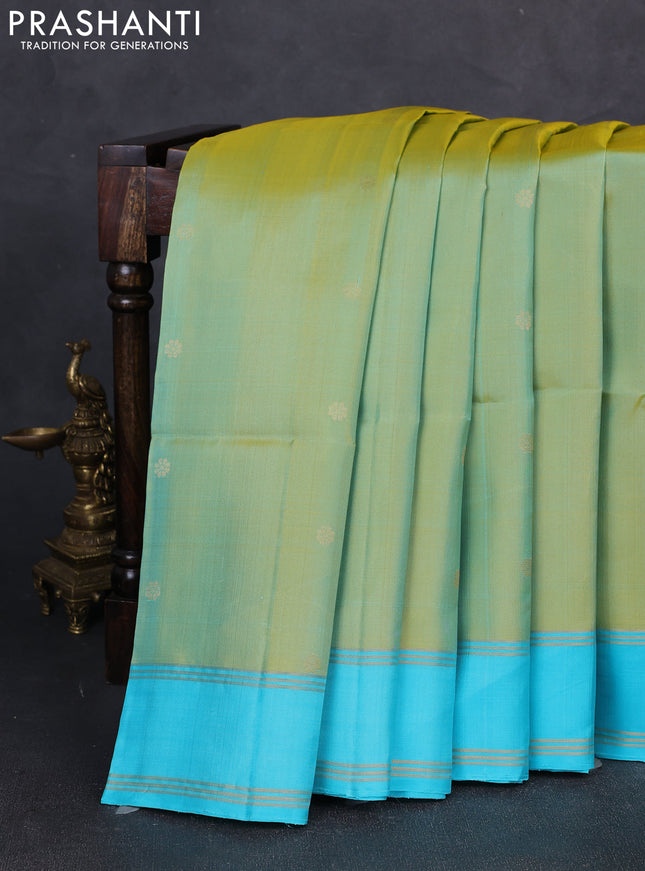 Pure soft silk saree dual shade of bluish yellow and teal blue with zari woven buttas and rettapet zari woven border
