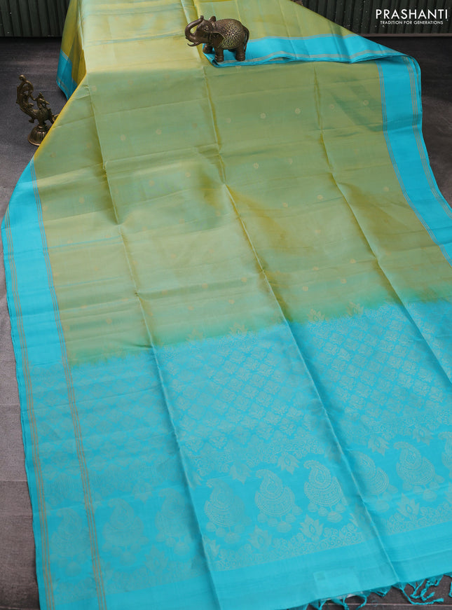 Pure soft silk saree dual shade of bluish yellow and teal blue with zari woven buttas and rettapet zari woven border