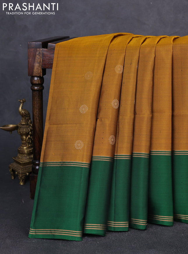 Pure soft silk saree dark mustard and green with zari woven buttas and rettapet zari woven border