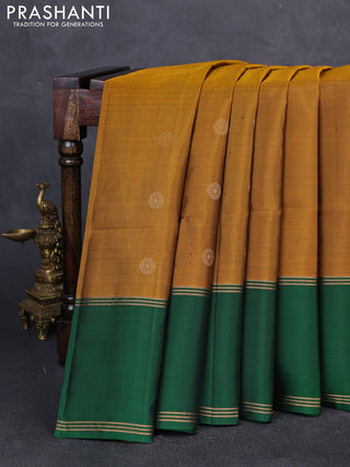 Pure soft silk saree dark mustard and green with zari woven buttas and rettapet zari woven border