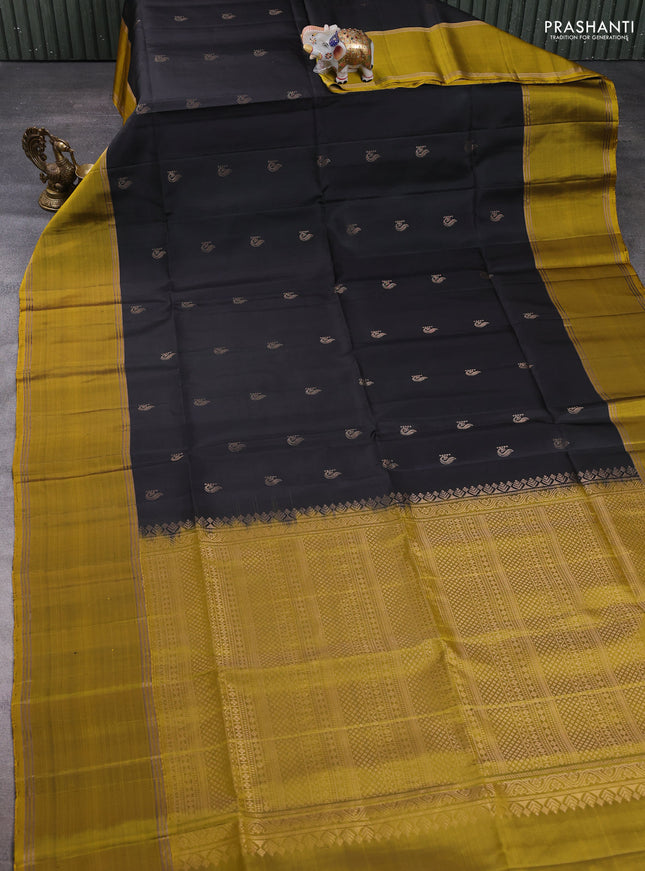 Pure soft silk saree black and mustard green with zari woven buttas and rettapet zari woven border