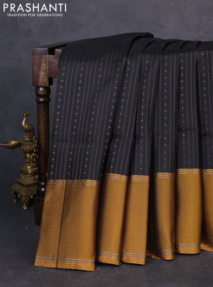 Pure soft silk saree black and dark mustard with allover zari weaves and long rettapet zari woven border