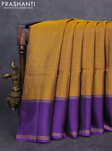 Pure soft silk saree dark mustard and violet with allover zari weaves and long rettapet zari woven border