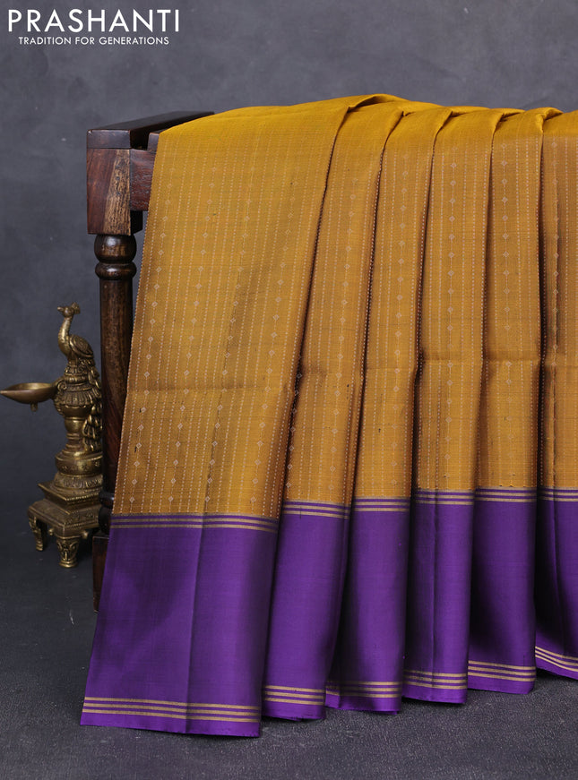 Pure soft silk saree dark mustard and violet with allover zari weaves and long rettapet zari woven border