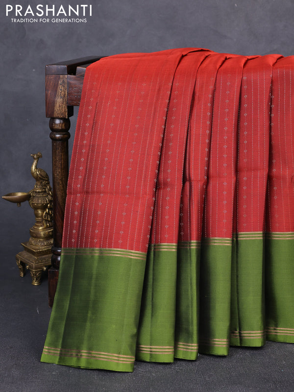 Pure soft silk saree rust shade and mehendi green with allover zari weaves and long rettapet zari woven border