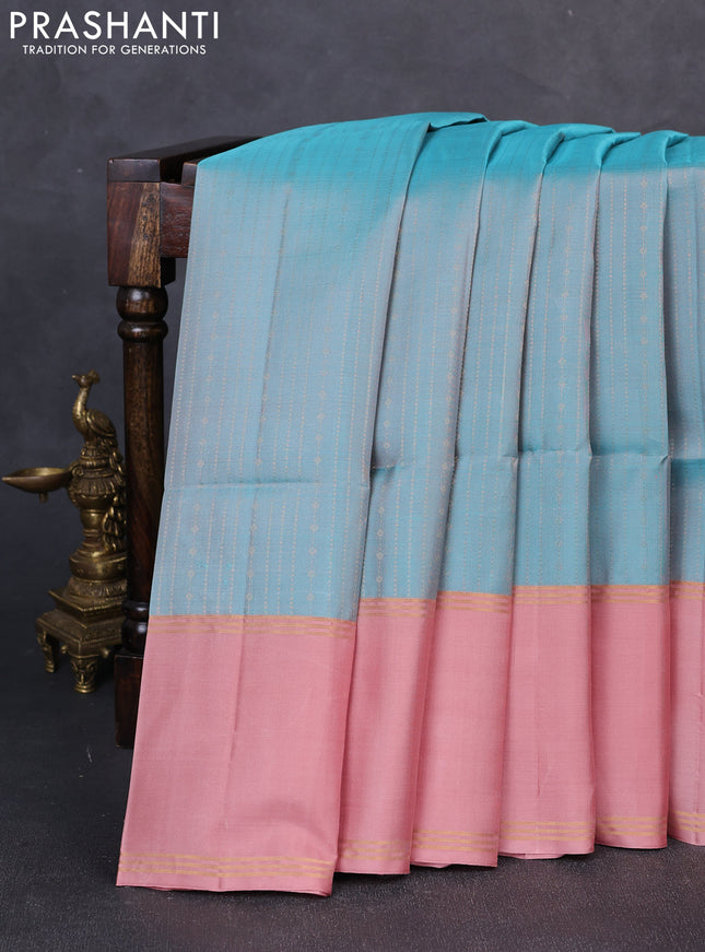 Pure soft silk saree teal blue and peach shade with allover zari weaves and long rettapet zari woven border