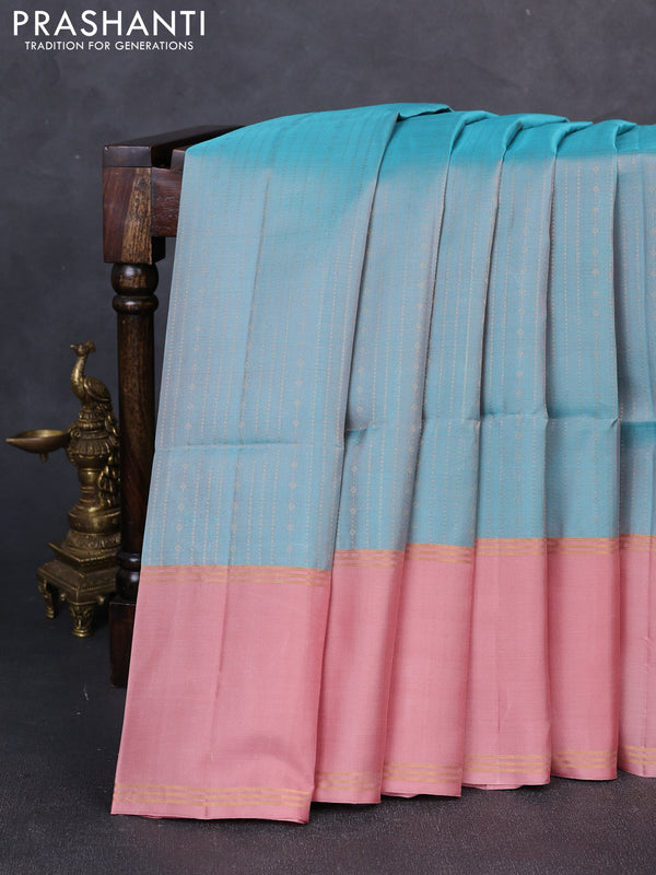 Pure soft silk saree teal blue and peach shade with allover zari weaves and long rettapet zari woven border