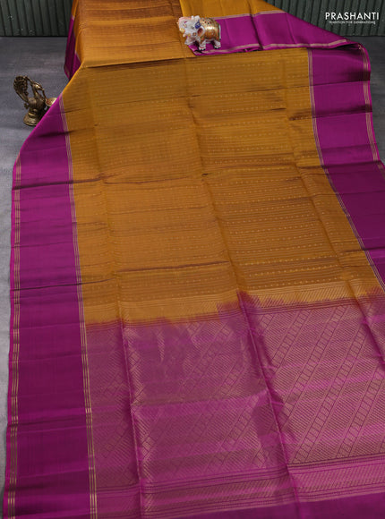 Pure soft silk saree dark mustard and magenta pink with allover zari weaves and long rettapet zari woven border