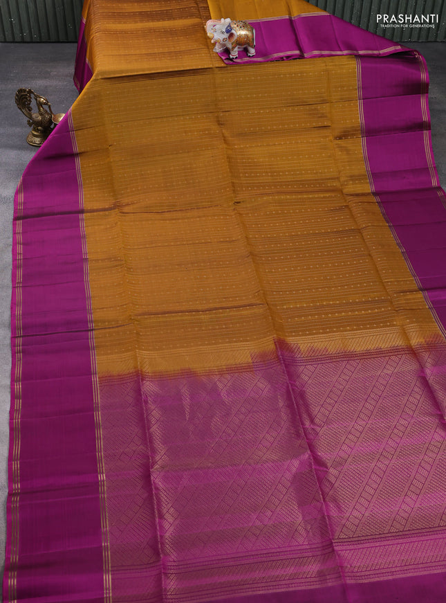 Pure soft silk saree dark mustard and magenta pink with allover zari weaves and long rettapet zari woven border