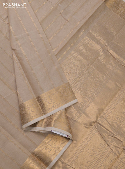 Kanchi cotton saree beige with allover zari stripe pattern and zari woven border