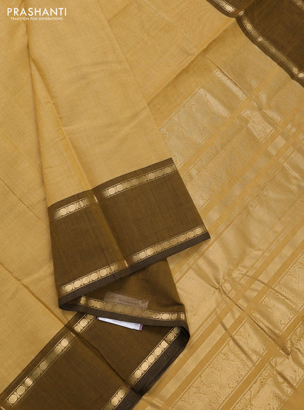 Kanchi cotton saree sandal and mustard green with allover zari stripe pattern and rettapet zari woven border