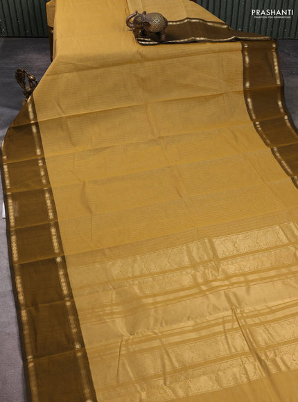 Kanchi cotton saree sandal and mustard green with allover zari stripe pattern and rettapet zari woven border