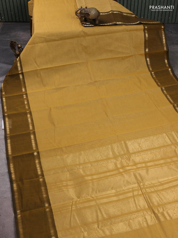 Kanchi cotton saree sandal and mustard green with allover zari stripe pattern and rettapet zari woven border