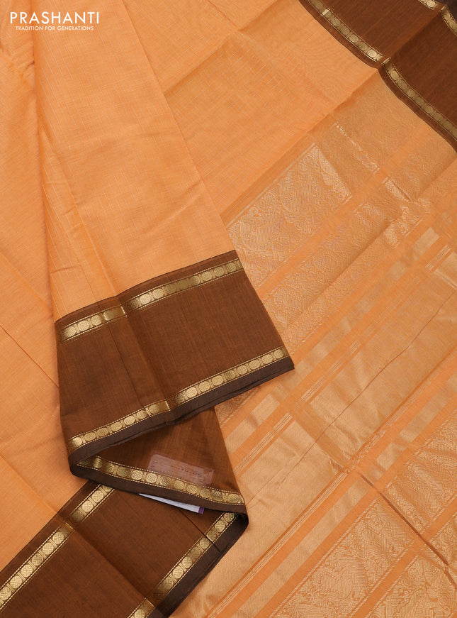 Kanchi cotton saree pale orange and dark mustard with allover zari stripe pattern and rettapet zari woven border