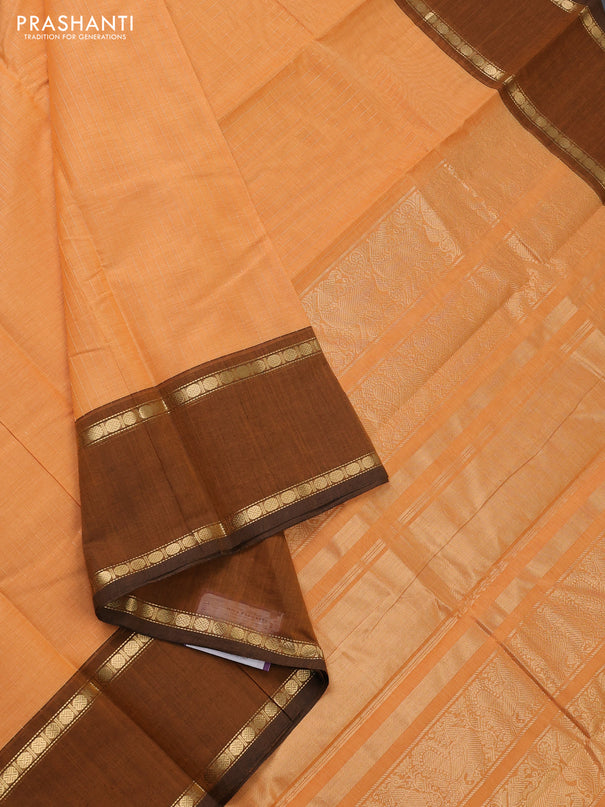 Kanchi cotton saree pale orange and dark mustard with allover zari stripe pattern and rettapet zari woven border