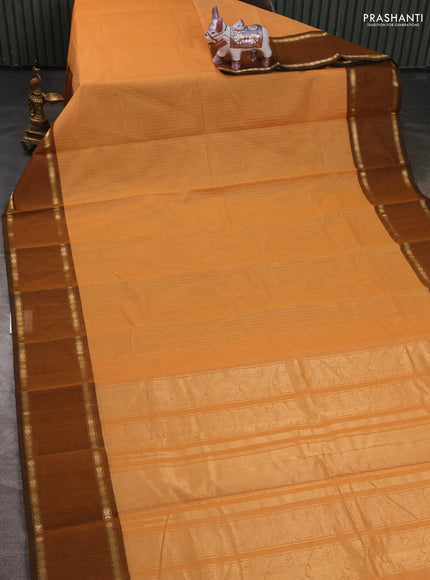Kanchi cotton saree pale orange and dark mustard with allover zari stripe pattern and rettapet zari woven border