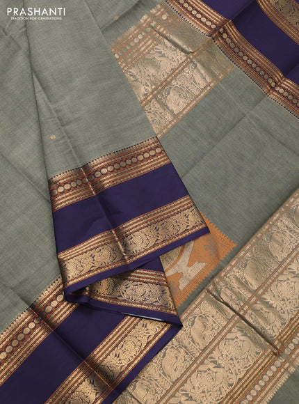 Kanchi cotton saree pastel green and navy blue with zari woven buttas and rettapet zari woven border