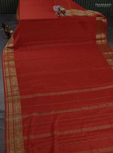 Pure mysore silk saree rust shade with plain body and long zari woven border