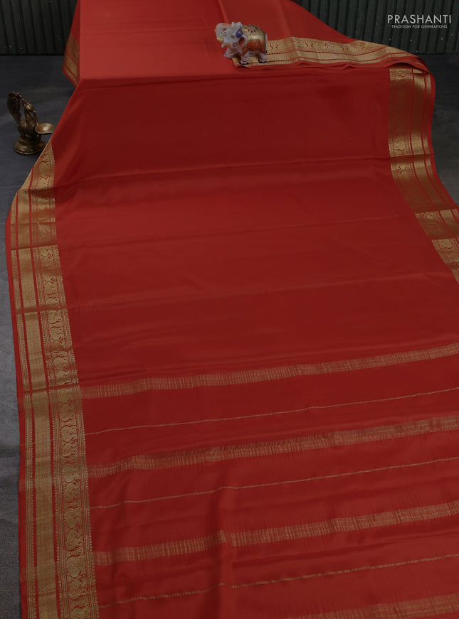 Pure mysore silk saree rust shade with plain body and long zari woven border