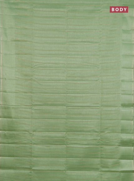 Semi tussar saree light green with allover silver & zari weaves pattern and simple zari woven border