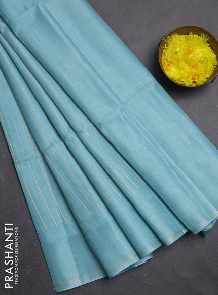 Semi tussar saree teal blue with allover silver & zari weaves pattern and simple zari woven border